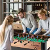 A family playing foosball in a living room. Náhľad obrázku produktu