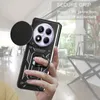 A hand holding a phone case with a ring holder and camera cover, with a blurred background of an interior setting. Produktbild-Vorschau