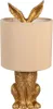 A gold-colored rabbit-shaped table lamp with a beige lampshade. Produktbild-Vorschau