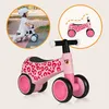 A collage showing a child riding a balance bike and a close-up of a pink balance bike with leopard print. Náhled obrázku produktu