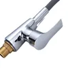A close-up view of a kitchen faucet handle and connection. Produktbild-Vorschau