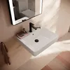 A modern bathroom sink with a black faucet and a pink soap dish, reflected in a mirror. Anteprima dell’immagine prodotto
