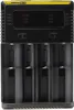 A close-up front view of a black battery charger with a yellow stripe at the top. Produktbild-Vorschau