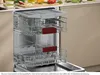 An open dishwasher with two racks visible, showing the interior compartments and cutlery basket. Produktbild-Vorschau