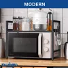 A kitchen counter with a microwave and a shelf above it holding various kitchen items. Produktbild-Vorschau