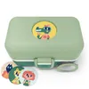 A light green lunchbox with cartoon animal stickers and a cartoon alligator sticker on the lid. Produktbild-Vorschau