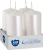 Four white pillar candles in a cardboard box. Anteprima dell’immagine prodotto