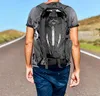 A person walking on a road with a backpack. Náhľad obrázku produktu