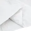 A close-up view of a white duvet or comforter, folded and creased. Podgląd zdjęcia produktu