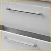 Close-up view of two white drawers with silver handles. Produktbild-Vorschau