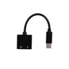 A black USB-C to 3.5mm headphone jack adapter with a charging port. Produktbild-Vorschau