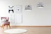 A child's room with a pink armchair, framed animal pictures, and two pendant lamps. Produktbild-Vorschau