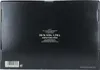 The image shows the back of a black cardboard box, likely packaging for a liquor product, with text and a barcode. Produktbild-Vorschau