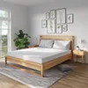 A bedroom scene with a bed, mattress, nightstands, and decor. Produktbild-Vorschau