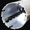 A close-up view of a hole saw with a drill bit inside, against a black background. Anteprima dell’immagine prodotto