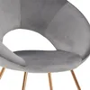 A close-up view of a gray velvet chair with copper legs. Produktbild-Vorschau