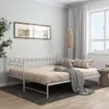A white metal daybed with a beige mattress and pillows is shown in a room with a large window and curtains. Produktbild-Vorschau