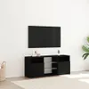 A black TV stand with a television mounted on the wall above it, in a room with a white wall and a light-colored rug. Anteprima dell’immagine prodotto
