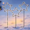 Three illuminated star-shaped garden stakes are planted in the snow. Náhľad obrázku produktu