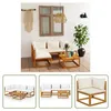 A patio setting with a wooden garden lounge set and decorative elements. Produktbild-Vorschau