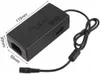 A black universal laptop power adapter with dimensions labeled. Produktbild-Vorschau