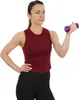 A woman is holding a small dumbbell and performing a bicep curl. Anteprima dell’immagine prodotto