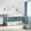 A bedroom with a white metal bunk bed, decorated with abstract art on the wall and a blue curtain. Produktbild-Vorschau