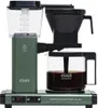 A close-up shot of a green Technivorm Moccamaster coffee maker with a glass carafe full of coffee. Náhľad obrázku produktu