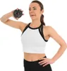 A woman is holding a small weight plate. Náhľad obrázku produktu