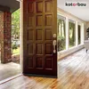 A brown door with a door sweep is shown open, leading into a room with large windows and wooden flooring. Produktbild-Vorschau