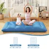 A woman and a child are meditating on a blue mattress in a living room. Náhled obrázku produktu