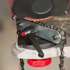 Close-up of a chainsaw sharpener in use, with sparks flying. Podgląd zdjęcia produktu