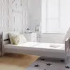 A child's bedroom with a bed, dresser, and wall decorations. Voir les images du produit