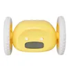 A yellow alarm clock with wheels is shown against a white background. Podgląd zdjęcia produktu