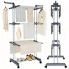 A product shot of a multi-tiered clothes drying stand with various garments and accessories displayed on it. Produktbild-Vorschau