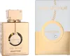 A perfume bottle and its packaging are displayed side-by-side against a white and gold background. Anteprima dell’immagine prodotto