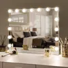 A makeup mirror with lights on a vanity. Produktbild-Vorschau