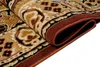 A close-up, folded view of a rug with a traditional pattern. Voir les images du produit