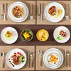 A collage of multiple table settings with various dishes and tableware. Voir les images du produit