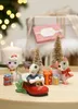 Christmas-themed display with cat figurines, gifts, and a candle. Produktbild-Vorschau