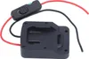 A black battery adapter with red and black wires and a black switch. Produktbild-Vorschau