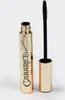 A gold-colored mascara tube with the cap off and the wand extended, set against a white background. Náhled obrázku produktu