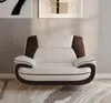 A modern sofa set in a living room setting with artwork on the wall. Produktbild-Vorschau