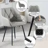 A grey armchair with black metal legs, shown in a room setting with various callouts highlighting its features. Produktbild-Vorschau