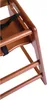 A close-up view of the wooden structure of a high chair, showing the seat and safety straps. Podgląd zdjęcia produktu
