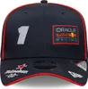 A close-up studio shot of a navy blue baseball cap with red trim and various logos and text. Náhled obrázku produktu