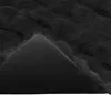A close-up view of a black faux fur blanket, showing the texture and underside. Podgląd zdjęcia produktu