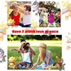 Collage of images showing children playing and a family having a picnic, with plush toys present. Produktbild-Vorschau