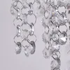 A close-up view of hanging crystal beads and metal rings, likely part of a chandelier or decorative light fixture. Náhľad obrázku produktu