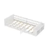 A white children's bed with a slatted base and a built-in shelf unit at the foot of the bed. Produktbild-Vorschau